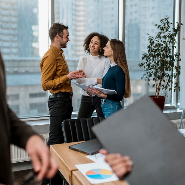 smiley-colleagues-office-meeting_23-2148817036